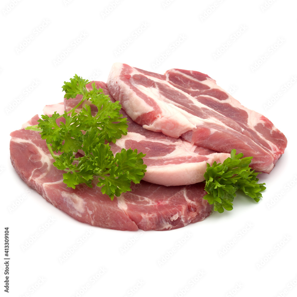 Raw pork neck chop meat with parsley herb leaves garnish isolated on white background cutout Raw pork neck chop meat with parsley herb leaves garnish isolated on white background cutout
