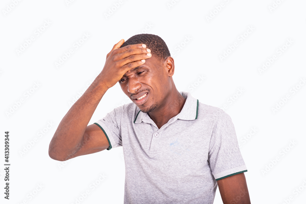 portrait of a young man suffering from headache. portrait of a young man suffering from headache.