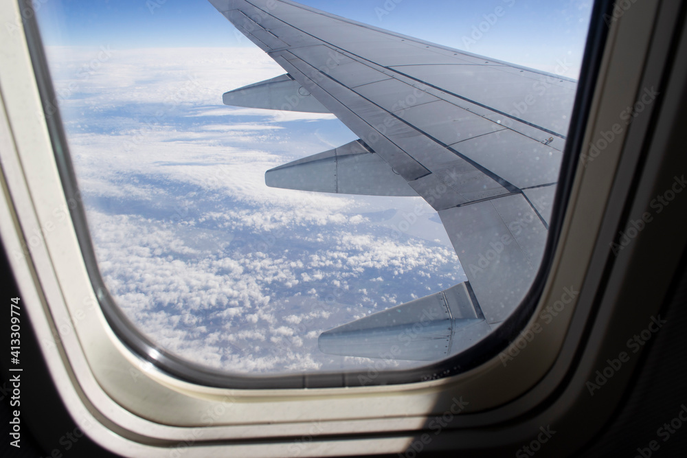 View of the wing from the window of the plane. View of the wing from the window of the plane.