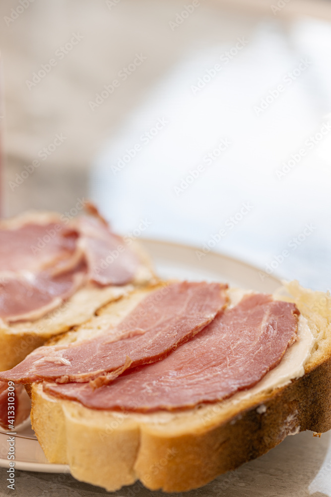 Sandwich with sliced dried ham on the bread