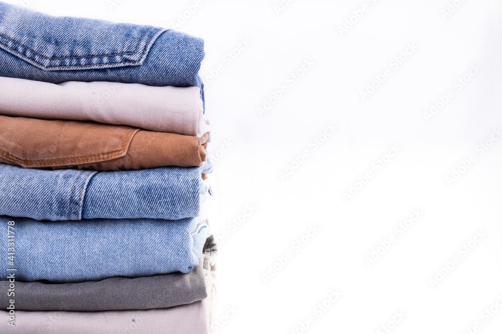 pants stacked on the left with a white background pants stacked on the left with a white background