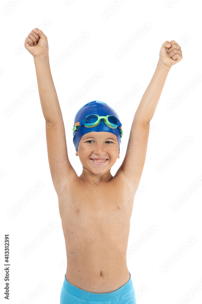 Happy boy with swim cap and swimming goggles make winner gesture, isolated on white. Winner hands raised