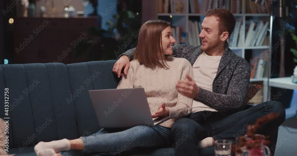 Cheerful young excited woman solving problem with internet connection rejoicing doing high-five with husband enjoying teamwork. Laptopcomputer. Home entertainment, Cheerful young excited woman solving problem with internet connection rejoicing doing high-five with husband enjoying teamwork. Laptopcomputer. Home entertainment,