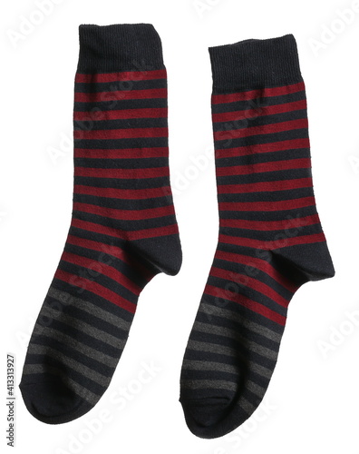 New striped colorful socks pair hanging isolated on white background, clipping path