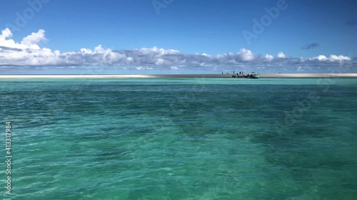White sand and transparent sea water. Nosy Iranjia near Nosy Be in Madagascar. Two islands connected by a tongue of sand influenced by the tide. Typical Malagasy boat. Panoramas of Madagascar.  Love.