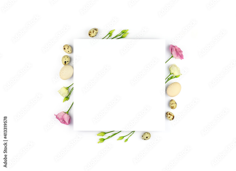 Fototapeta premium Easter composition. Easter eggs, flowers, paper blank on white background. Flat lay, top view, copy space, mock up.