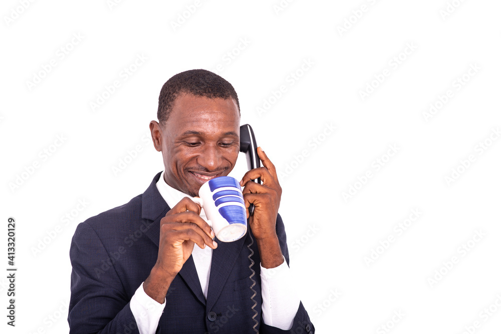 adult businessman talking on mobile phone and drinking coffee. adult businessman talking on mobile phone and drinking coffee.