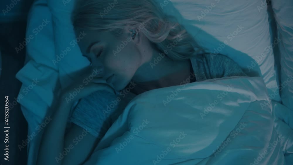 top view of woman tossing and turning while sleeping at night