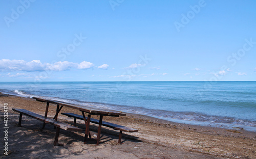 Isolated Picnic table on the Beautiful Beach of Huron Lake near Goderich, Ontario, Canada © Margarita
