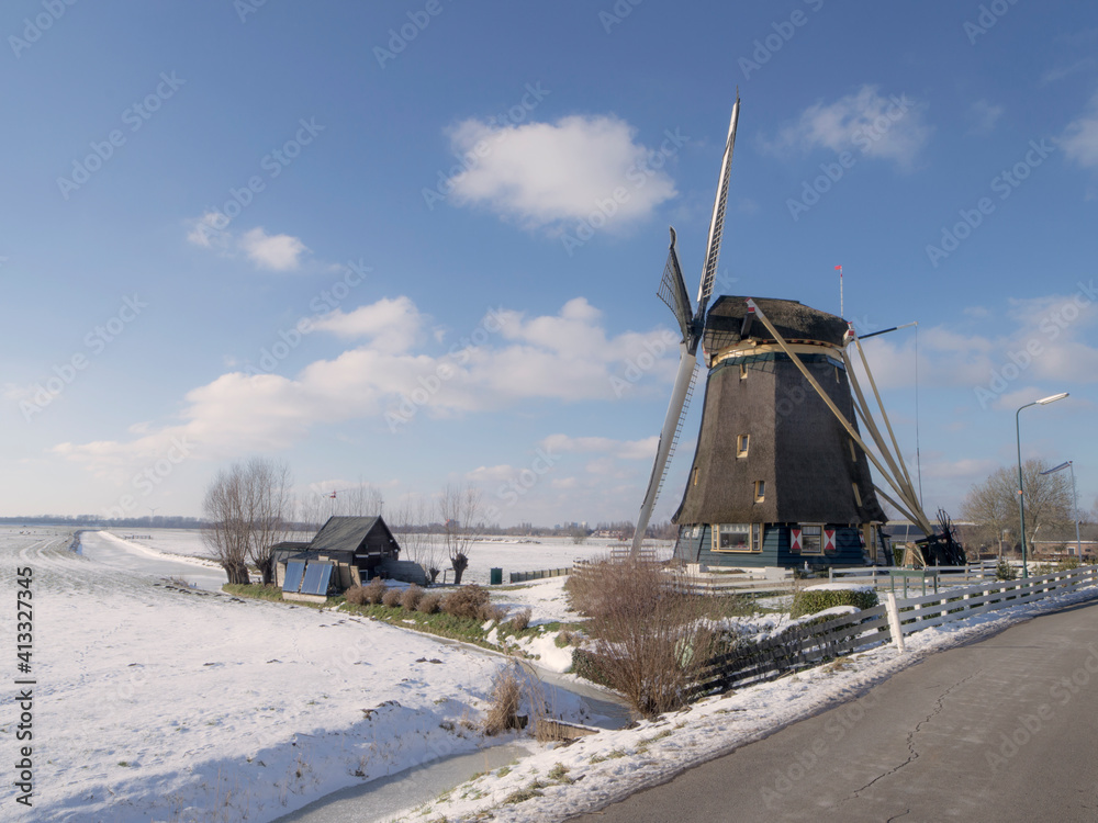 The dutch windmill the Broekzijdse Molen in the snow