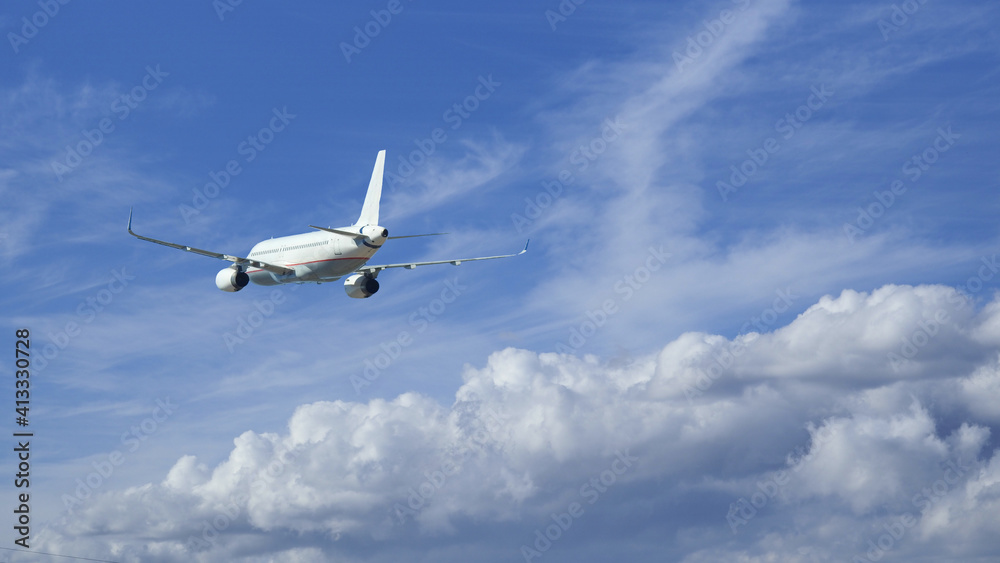 Obraz premium Zoom photo of passenger airplane taking off in deep blue cloudy sky
