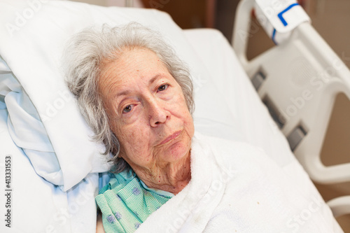 Elderly eighty plus year old woman in a hospital bed
