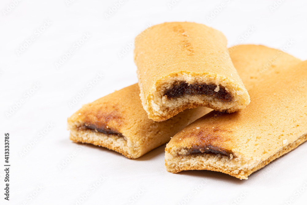 Cookies with fruit filling above white background