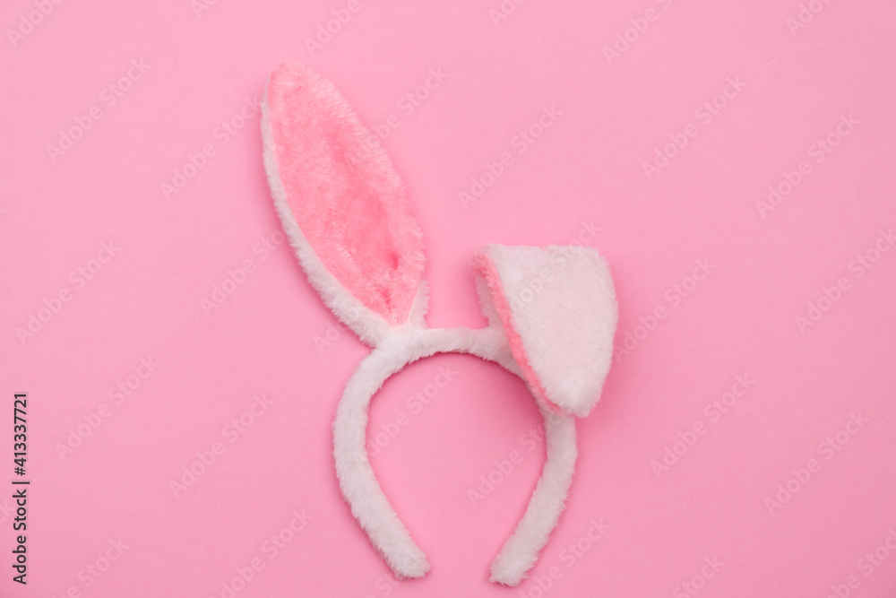 Easter bunny. Happy Easter holiday background concept.Flat lay colorful bunny egg with accessory to celebration on modern rustic pink pastel paper at home office desk. Easter bunny. Happy Easter holiday background concept.Flat lay colorful bunny egg with accessory to celebration on modern rustic pink pastel paper at home office desk.