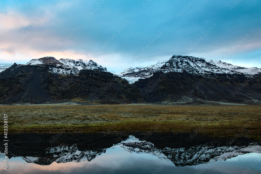 Iceland, reflection of the mountains in the Vatnajökull glacier. Panoramic view of the Vatnajökull National Park. Europe