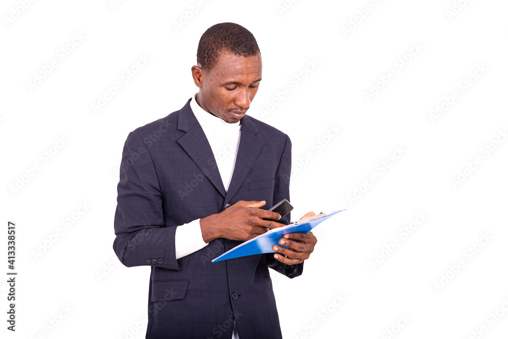 portrait of a handsome businessman with notepad and cellphone. portrait of a handsome businessman with notepad and cellphone.
