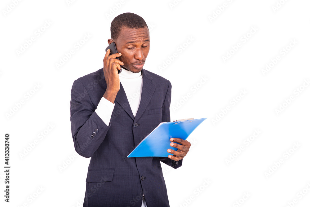 portrait of a handsome businessman with notepad and cellphone. portrait of a handsome businessman with notepad and cellphone.