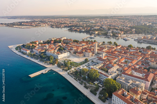 Aerial drone shot of Zadar old town peninsula with sea organ in sunrise in Croatia Dalmatia