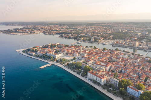 Aerial drone shot of Zadar old town peninsula with sea organ in sunrise in Croatia Dalmatia © Davidzfr