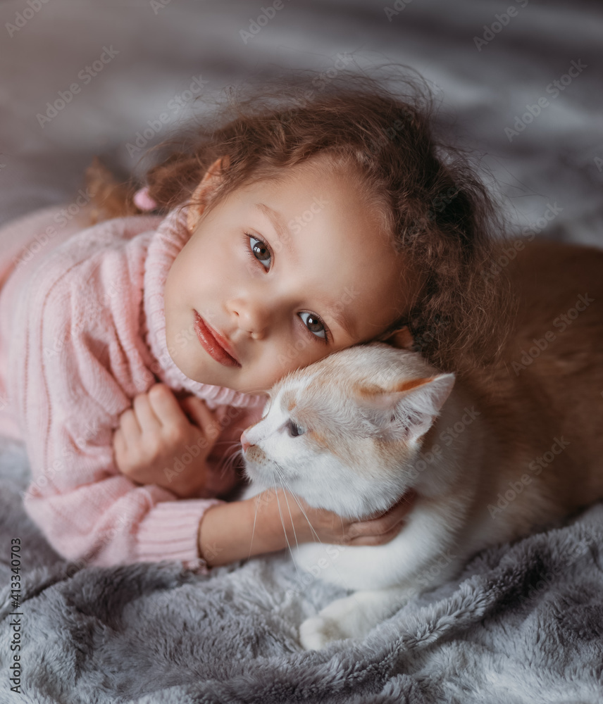 Beautiful little girl with her cat close up Beautiful little girl with her cat close up