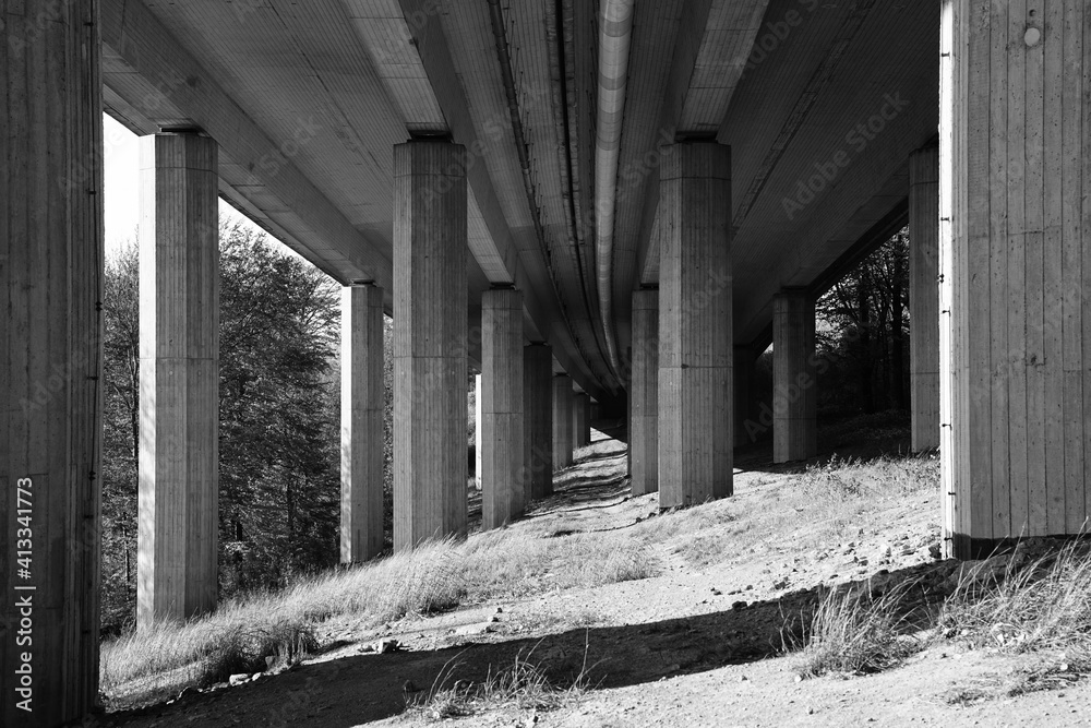 Motorway modern concrete bridge, underneath black and white photo Motorway modern concrete bridge, underneath black and white photo