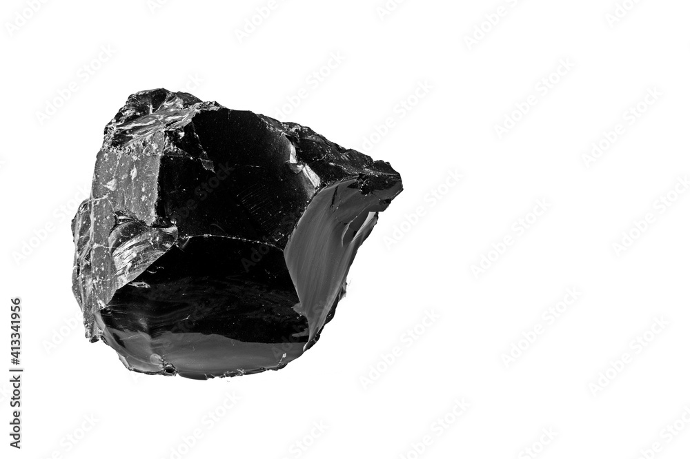 A large piece of Obsidian isolated on a white background. Obsidian is a naturally occurring volcanic glass formed when felsic lava extruded from a volcano cools rapidly with minimal crystal growth.