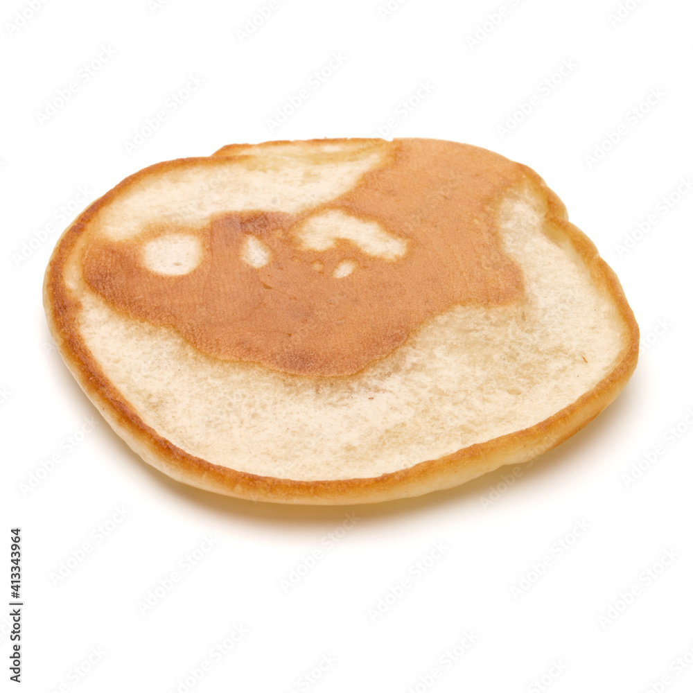 One pancake isolated on white background cutout. One pancake isolated on white background cutout.