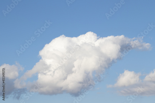 Fotografija White fleecy cloud in the sk