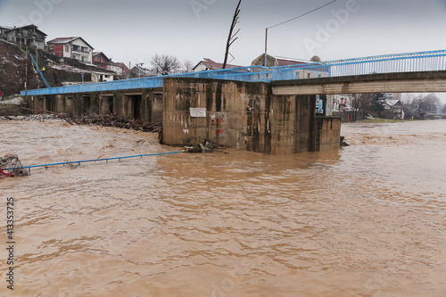 River after flood with plastic and wood pollution . Vlasina river, Serbia. Ecology problem. photo