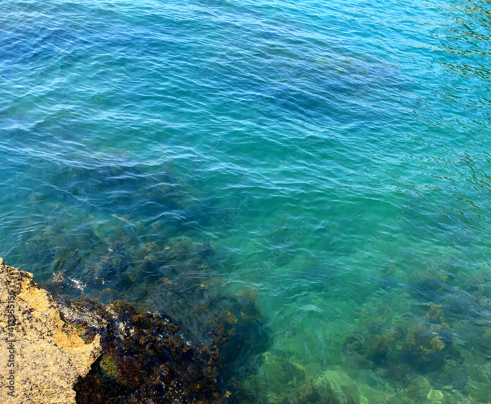 Turquoise sea crystal clear water, rippled waves of Mediterranean sea.