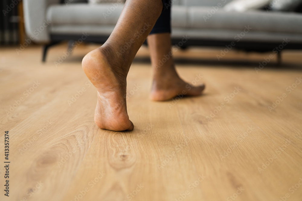 African Barefoot Woman Walking On Heated Floor African Barefoot Woman Walking On Heated Floor