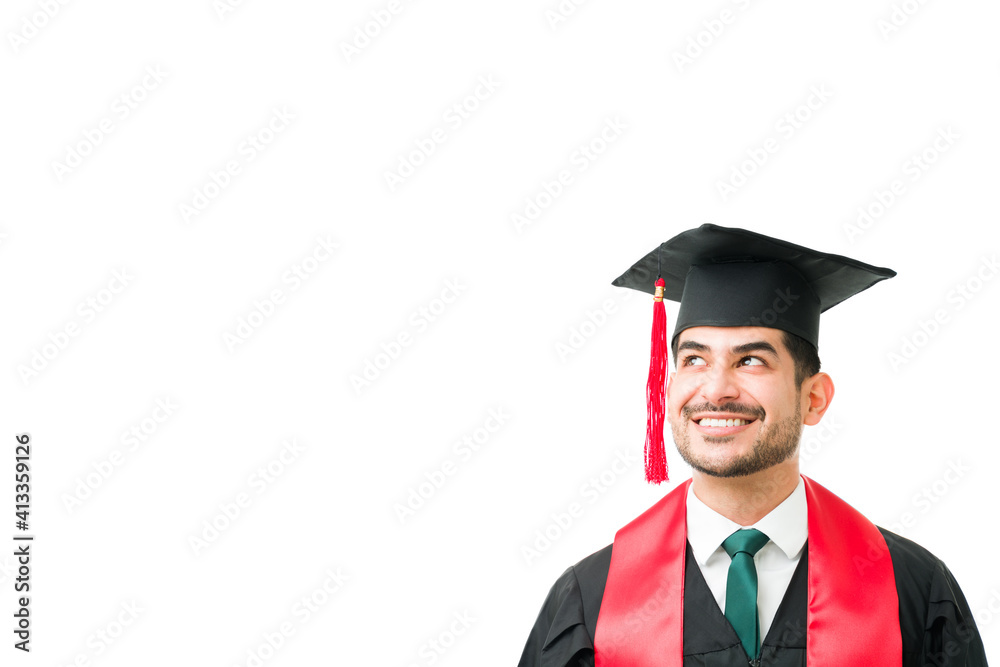Thoughtful young man feeling happy after graduating Thoughtful young man feeling happy after graduating
