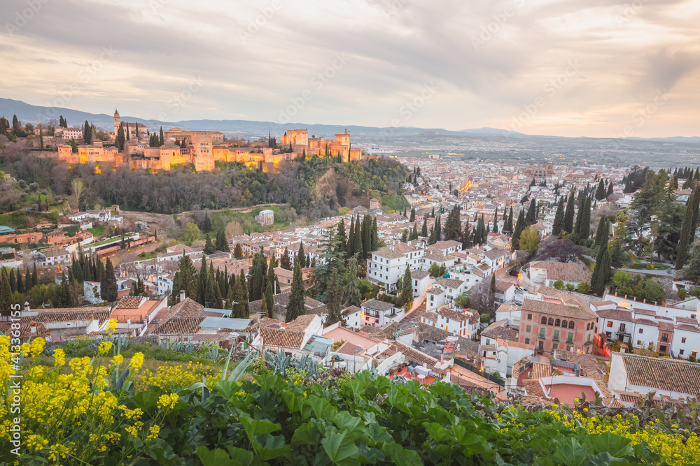Sunset or sunrise cityscape view of the Alhambra and the historic Moorish or Arab Quarter (albaicin) in Granada, Andalusia, Spain.