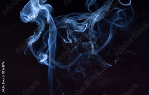 blue jet wave of smoke isolated on black background