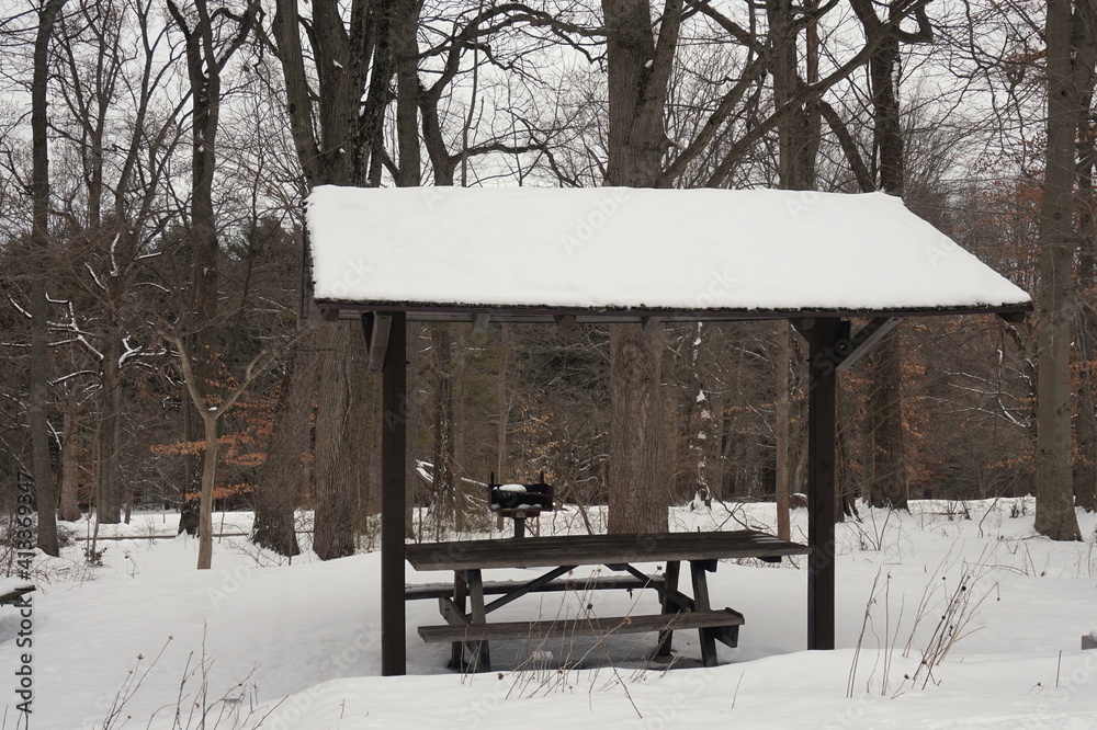Wooden Picnic Table and Shelter in Snowy Park Wooden Picnic Table and Shelter in Snowy Park