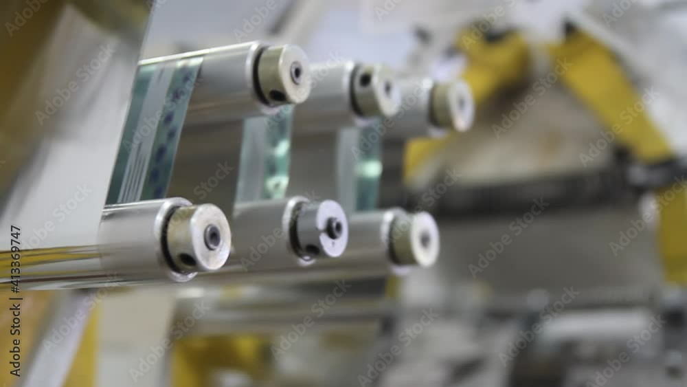 candy wrapper. industrial packing line on factory. automation of production. conveyor.