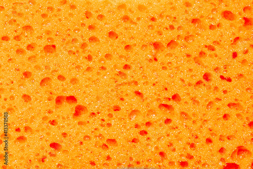 orange bath sponge texture pattern. tool for personal body care cut out. hygiene concept. background backdrop