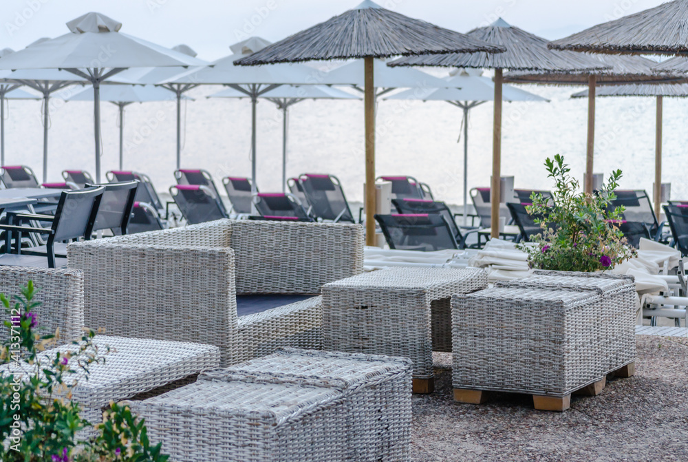 Pefkochori, Greece - May 30, 2016: Beach with umbrellas on the coast of Pefkochori, Greece Pefkochori, Greece - May 30, 2016: Beach with umbrellas on the coast of Pefkochori, Greece