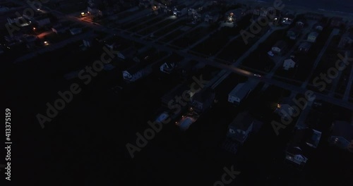 Aerial drone shot of night fall along Nags Head, North Carolina ocean shoreline in the Outer Banks.   photo