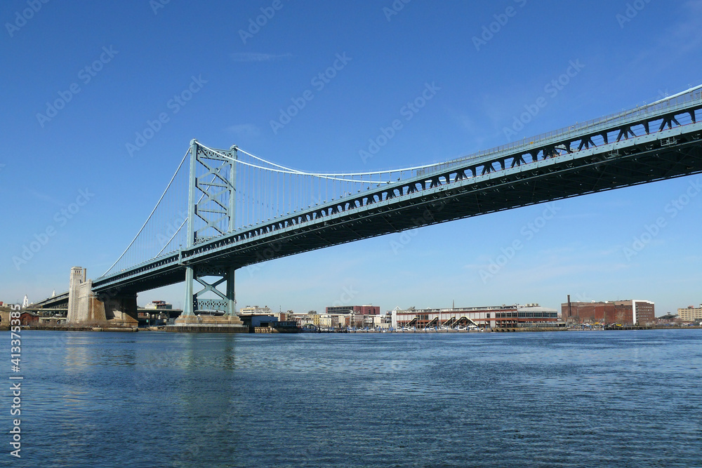 Waterfront view of the Benjamin Franklin Bridge between downtown Philadelphia, Pennsylvania and Camden, New Jersey.