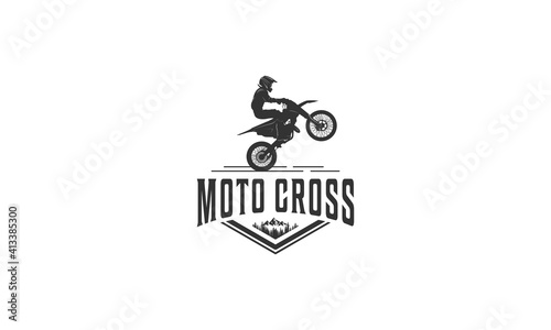 logo adventure using a motorcycle around the mountain trails in white background