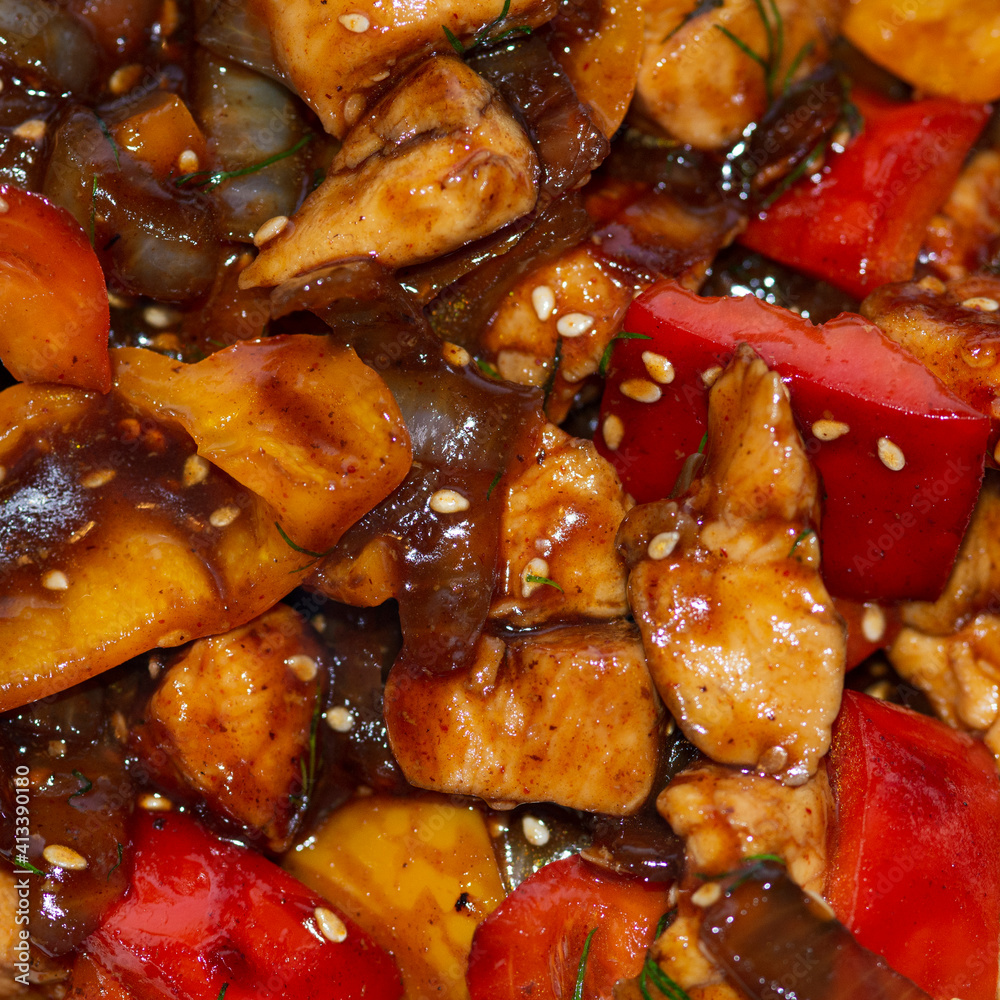 Braised chicken with onion, sweet pepper and sesame seeds in a dark sauce. Braised chicken with onion, sweet pepper and sesame seeds in a dark sauce.