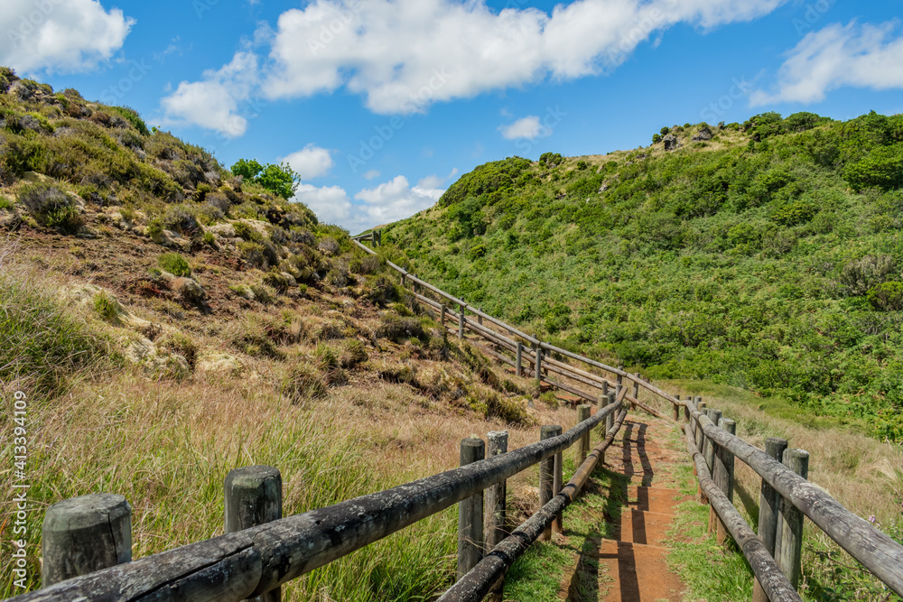 Pathway with wooden fence between hills in Furnas de Enxofre, Terceira - Azores PORTUGAL