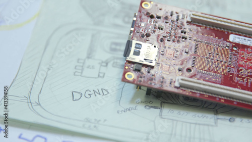 circuit board on top of a circuit diagram 