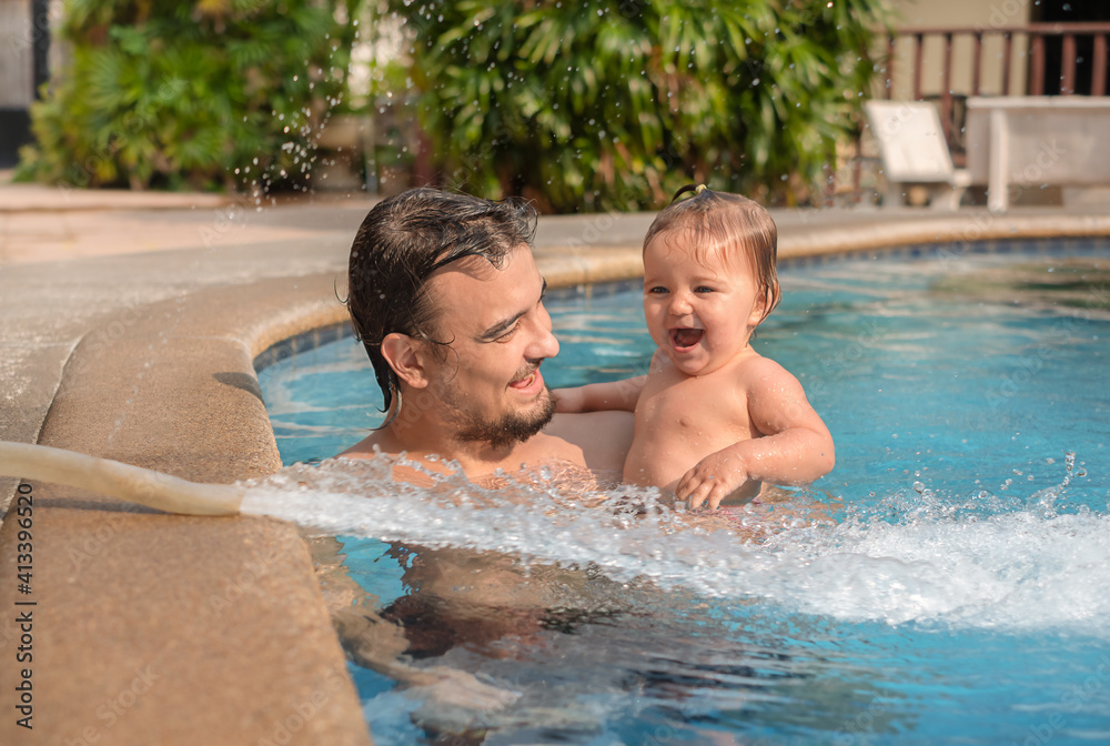Father with baby in the pool. Father with baby in the pool.
