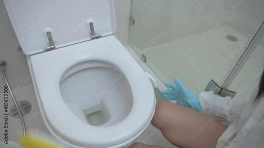 Holiday concept of 4k Resolution. Young women inject cleaner in the bathroom. Holiday concept of 4k Resolution. Young women inject cleaner in the bathroom.