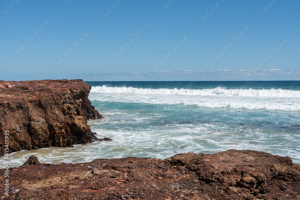 waves crashing on rocks on beach waves crashing on rocks on beach