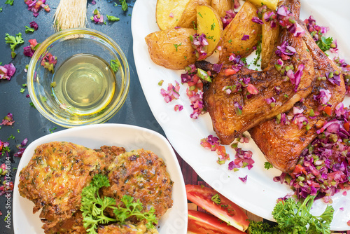 Baked chicken with potatoes and salad 
