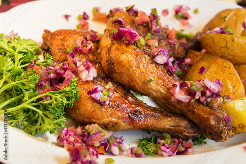 Baked chicken with potatoes and salad 