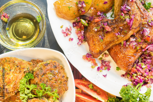 Baked chicken with potatoes and salad 